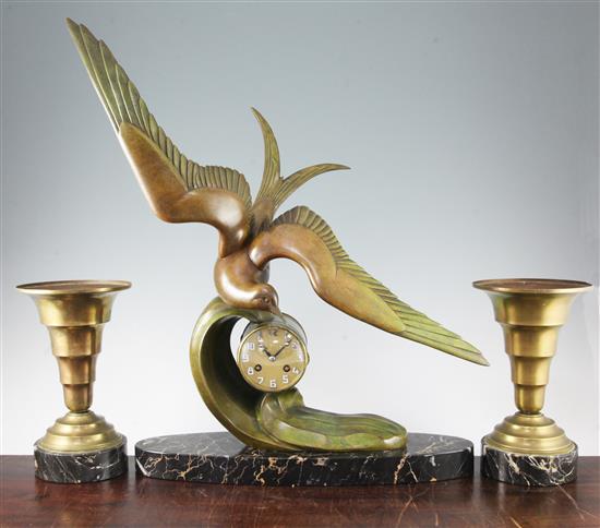 An Art Deco bronzed spelter clock garniture, height overall 24in.